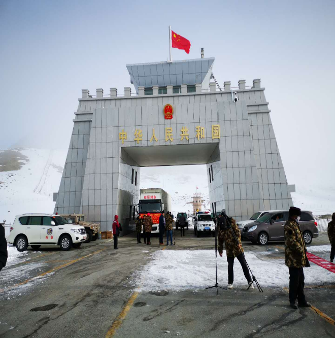 Couple at viewpoint overlooking lake
